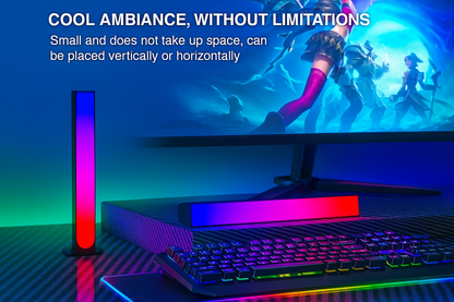 RGB ambient light bars on gaming desk creating colorful atmosphere beside monitor